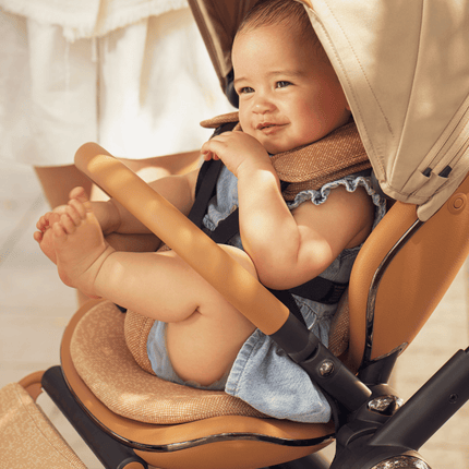 Closeup of a baby in the Mima Creo Stroller Mocha