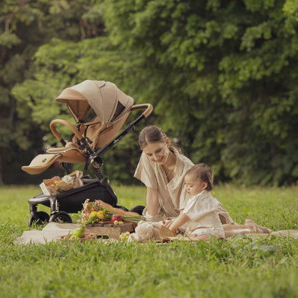 Mima Creo Stroller Mocha at a picnic in the garden.