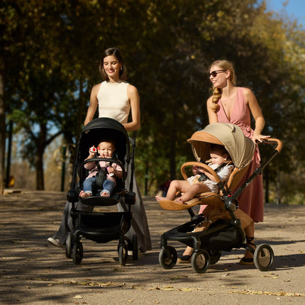 Mima Creo Stroller Mocha on a leisurely stroll in the park.