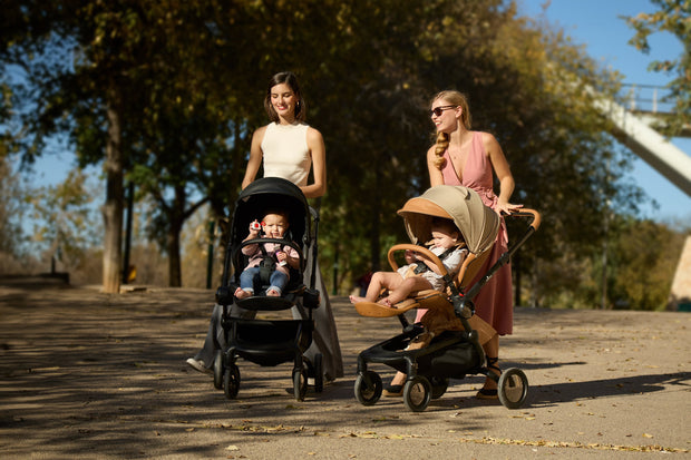 Mima Creo Stroller Mocha on a leisurely stroll in the park.