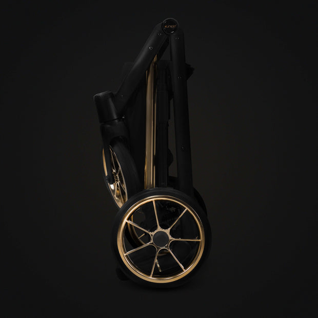 Elegant folded Kunert Stroller IVENTO showcasing its compact design and golden wheels