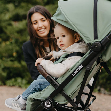 Baby inside the Coccolle Lightweight Stroller MELIA