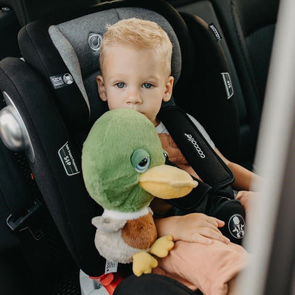 Toddler with a toy inside the Coccolle Car Seat NERIO 