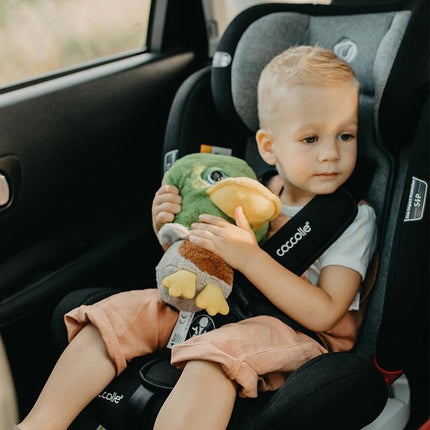 Toddler with a toy inside the Coccolle Car Seat NERIO