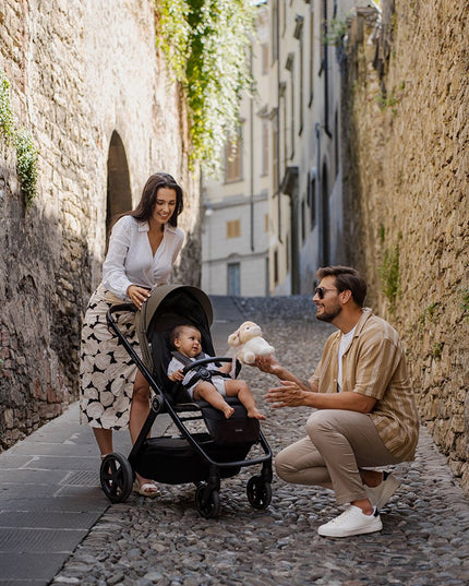 Family with baby inside the Espiro Only Way Stroller