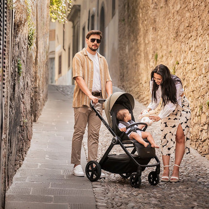 Family with baby inside the Espiro Only Way Stroller