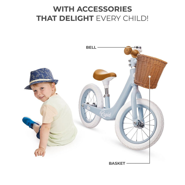 Young boy with Kinderkraft Balance Bike RAPID 2 showcasing bike's accessories.