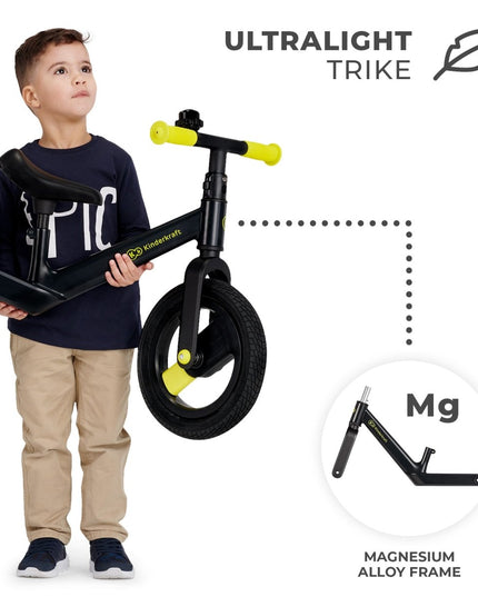 Young boy holding a black Kinderkraft Balance Bike GOSWIFT with ultralight magnesium frame.