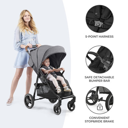 Woman with Kinderkraft Stroller GRANDE PLUS, showing harness and brake