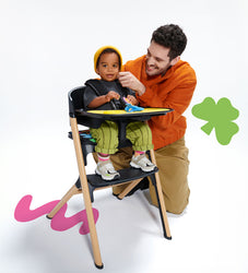 Kinderkraft High Chair with father and son sharing a meal and playing together