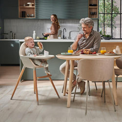 Kinderkraft High Chair in a modern kitchen setting with a family having breakfast