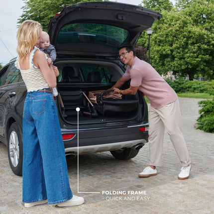 Kinderkraft MOOV 2 Stroller being loaded into a car, showcasing its quick and easy folding frame.