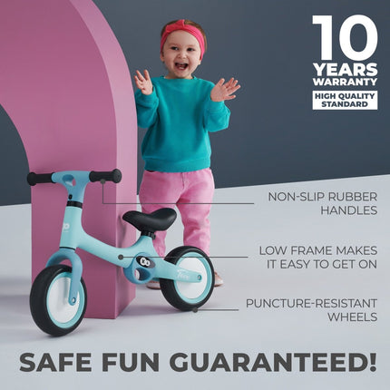 Excited child with Kinderkraft Balance Bike TOVE, 10-year warranty promotion