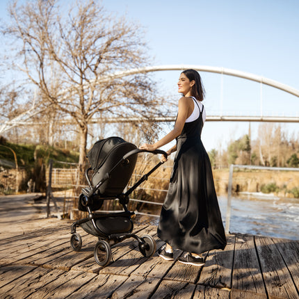 Strolling by the lake with the Mima Creo Stroller Black.