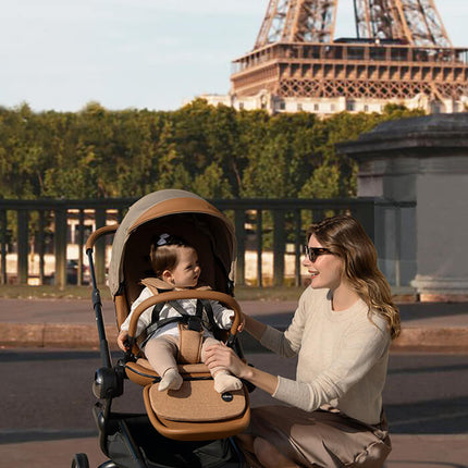 Mother and child enjoying the view of the Eiffel Tower with Mima Creo Stroller Mocha.