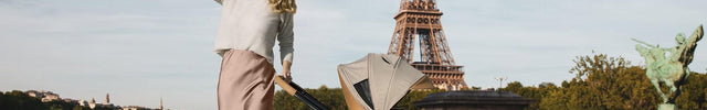 Woman with Mima Creo Stroller Mocha walking near Eiffel Tower