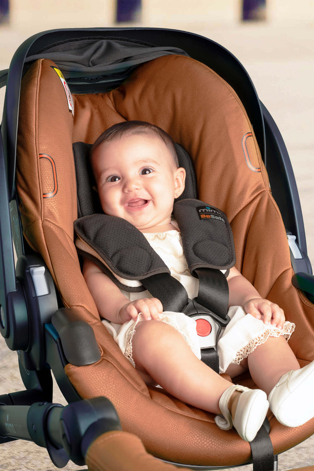 Happy baby in Mima iZi GO Modular X1 Car Seat.