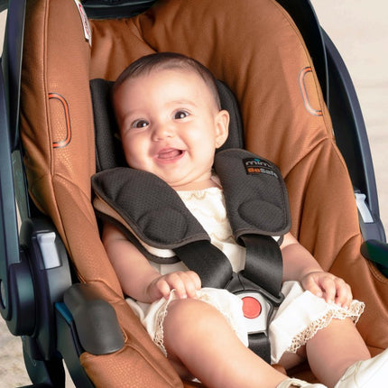 Happy baby in Mima iZi GO Modular X1 Car Seat.