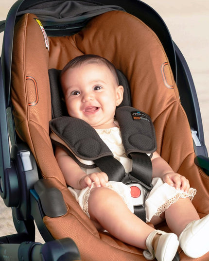 Happy baby in Mima iZi GO Modular X1 Car Seat.