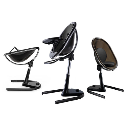 Mima Moon High Chair in Black and White, showcasing three configurations: reclined, upright, and toddler seat.