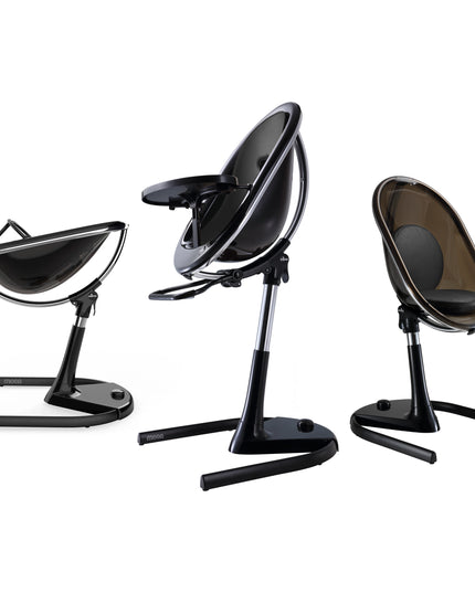 Mima Moon High Chair in Black and White, showcasing three configurations: reclined, upright, and toddler seat.