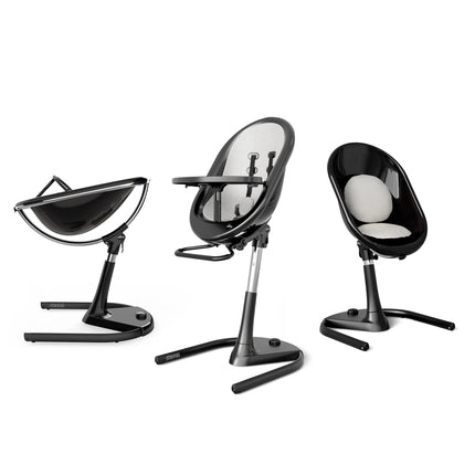 Mima Moon High Chair in black and white, highlighting three configurations: reclined, upright, and toddler seat.