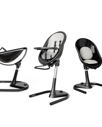 Mima Moon High Chair in black and white, highlighting three configurations: reclined, upright, and toddler seat.