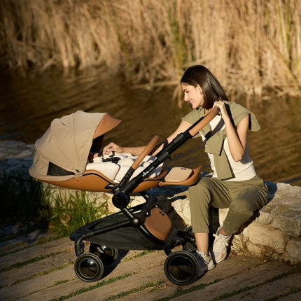 Mima Creo Stroller Mocha woman sitting peacefully by river