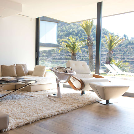 Luxurious living room with panoramic view and Mima Moon High Chair.