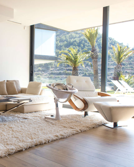 Luxurious living room with panoramic view and Mima Moon High Chair.