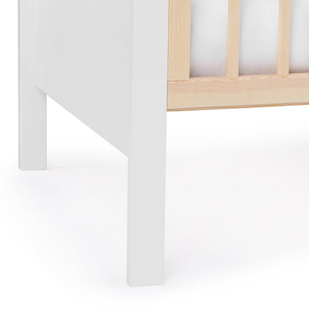Close up view of Kinderkraft Baby Cot MIA with white mattress.