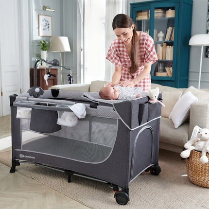 Kinderkraft Travel Cot LEODY in home setting with mother and baby