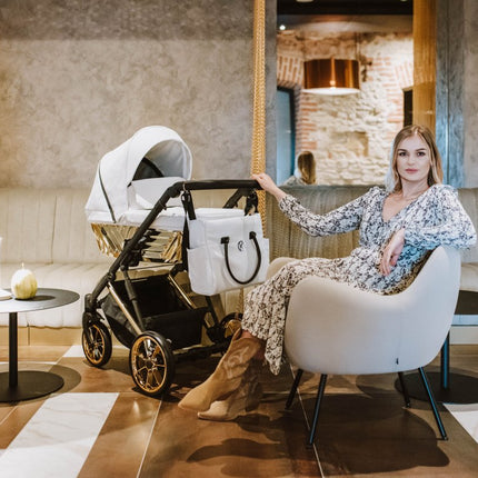 Woman sitting and holding the Kunert Ivento Glam Stroller 